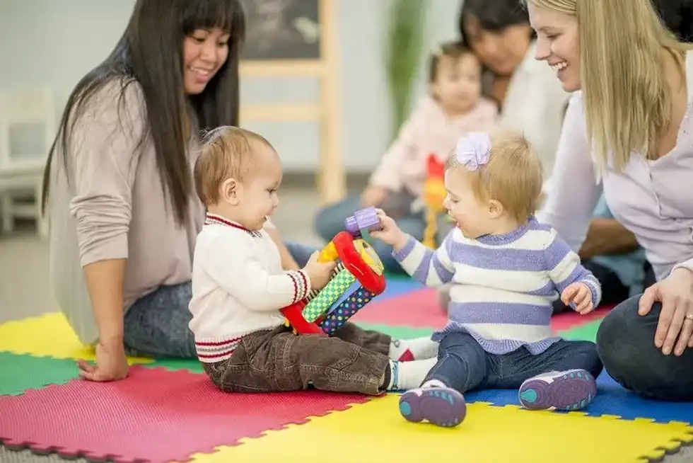 A baby playing in London