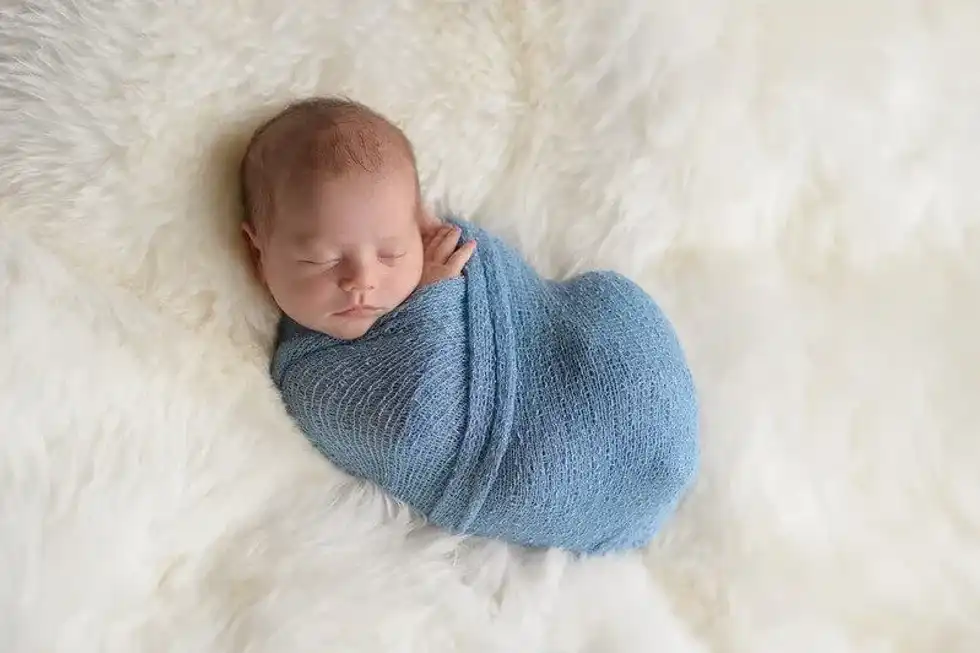 A baby sleeps peacefully in their baby-proofed home