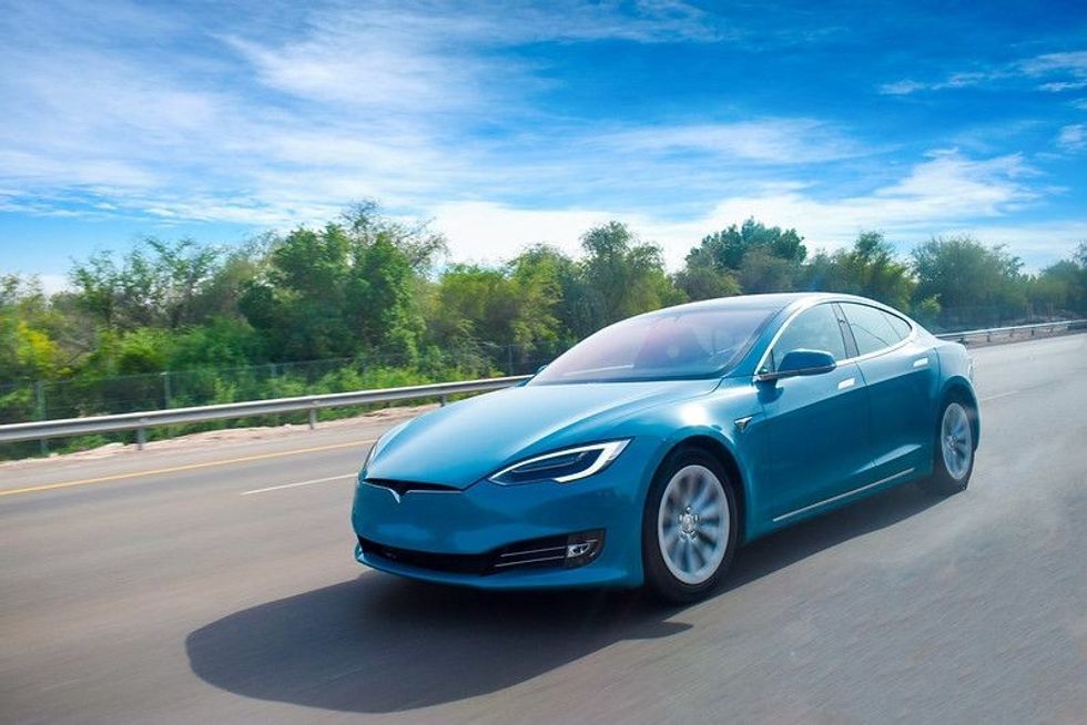 A blue coloured electric car cruising on highway - Nicknames