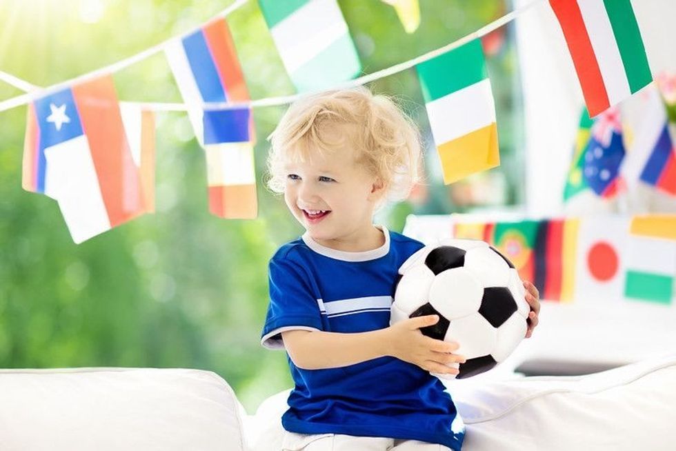A boy holding a football