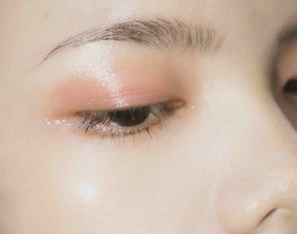 A close up shot of person's eye showing the eyelashes.