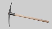 A closeup shot of a pickaxe on the gray background.