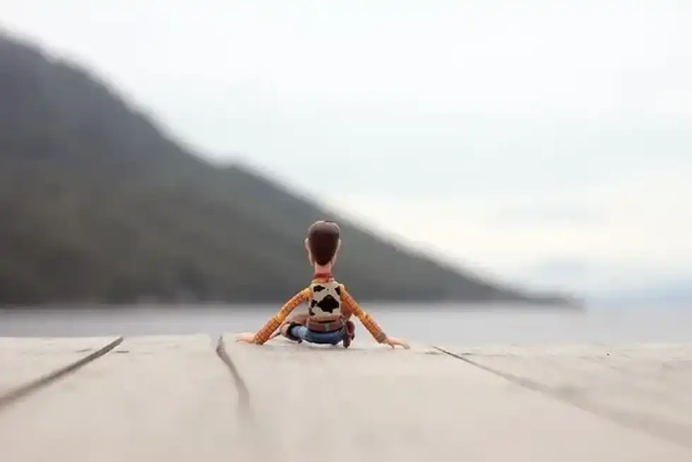 A Disney figurine sitting on deck 