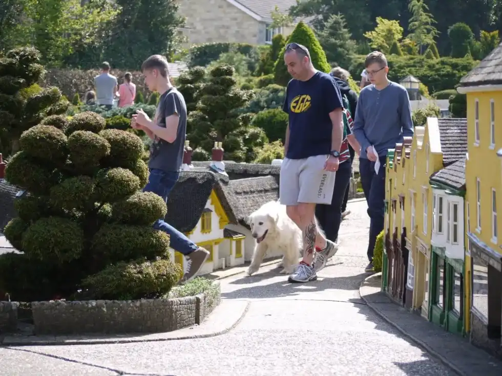 A family visits Godshill Model Village in the Isle of Wight.