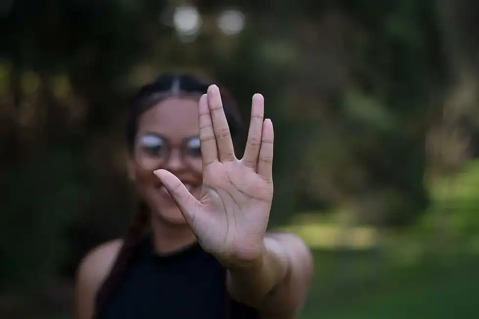 A girl giving Vulcan salute from Star Trek series