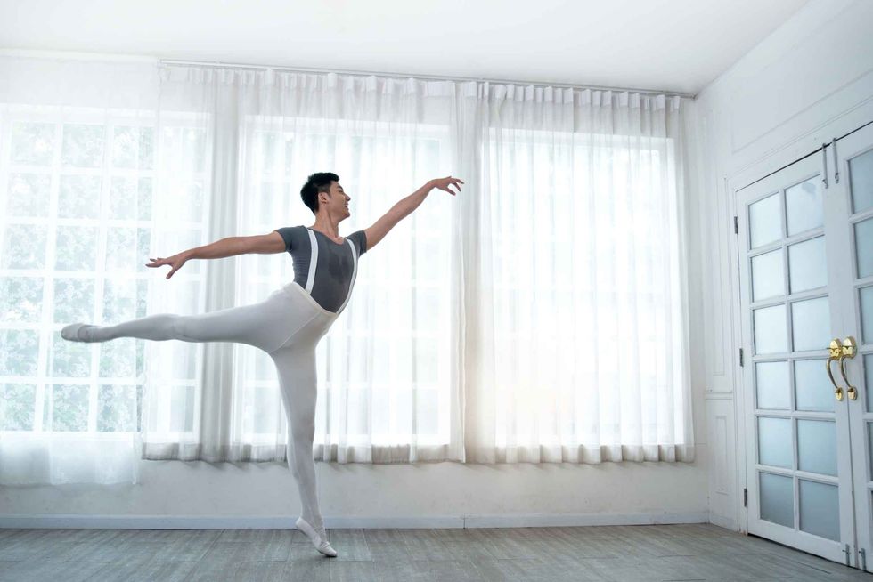 A handsome young male dancer practicing