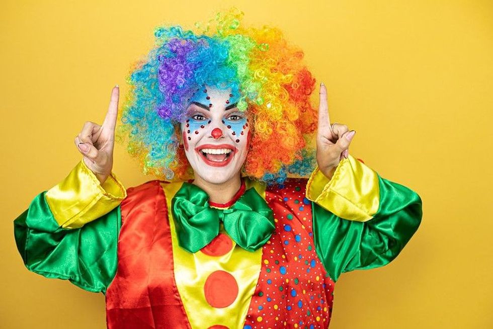 A happy and colourful female clown