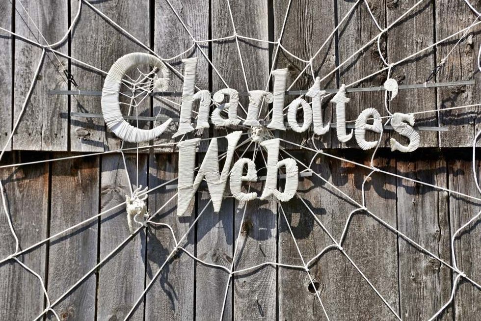 A horizontal image of the wall display for an upcoming performance of "Charlotte's Web" at historic Old Sturbridge Village.