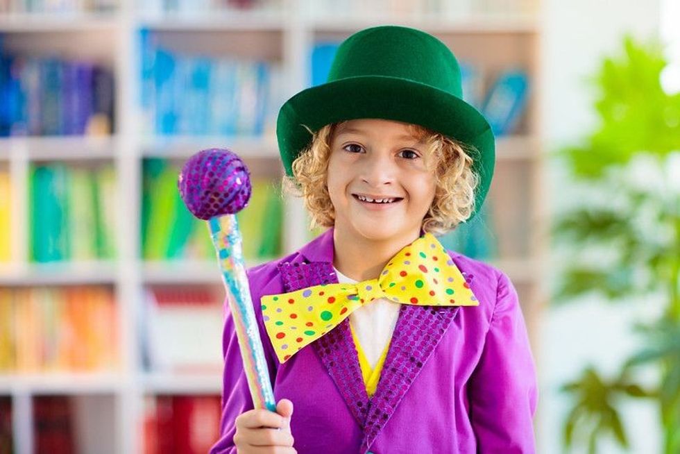 A kid dressed as funny magician.