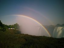 A lunar rainbow or a moonbow on the Victoria Falls observed within 2 days of full moon. Since the lunar rainbows are much fainter than the day-time ones, long-time exposure is mandatory.