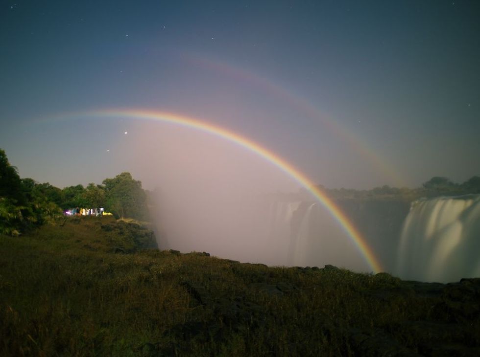 A lunar rainbow or a moonbow on the Victoria Falls observed within 2 days of full moon. Since the lunar rainbows are much fainter than the day-time ones, long-time exposure is mandatory.