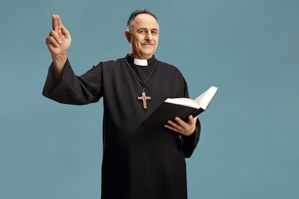 A man holding bible in hand