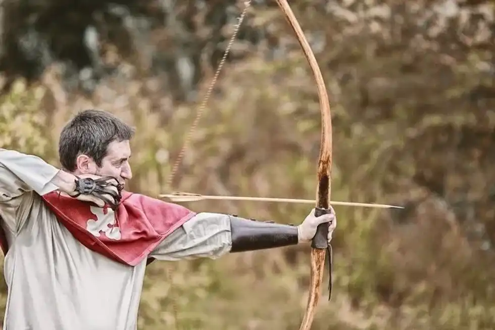 A man shooting arrow from his bow