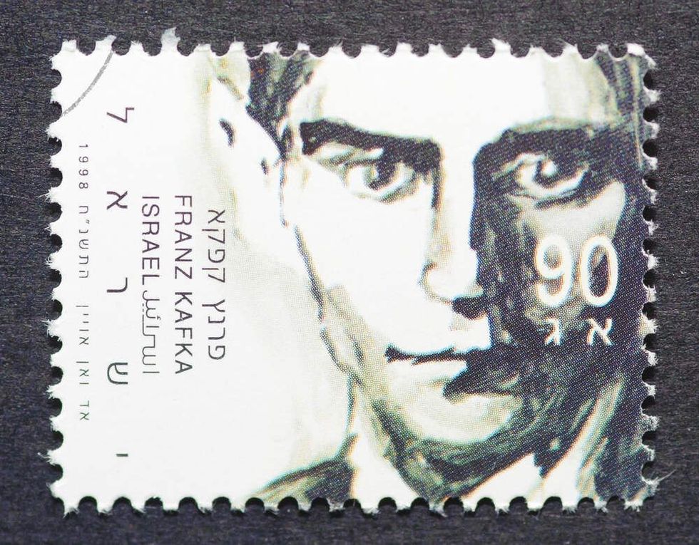 a postage stamp printed in Israel showing an image of writer Frank Kafka, circa 1998.
