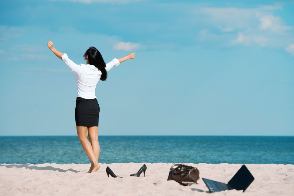 A professional woman taking a break at beach