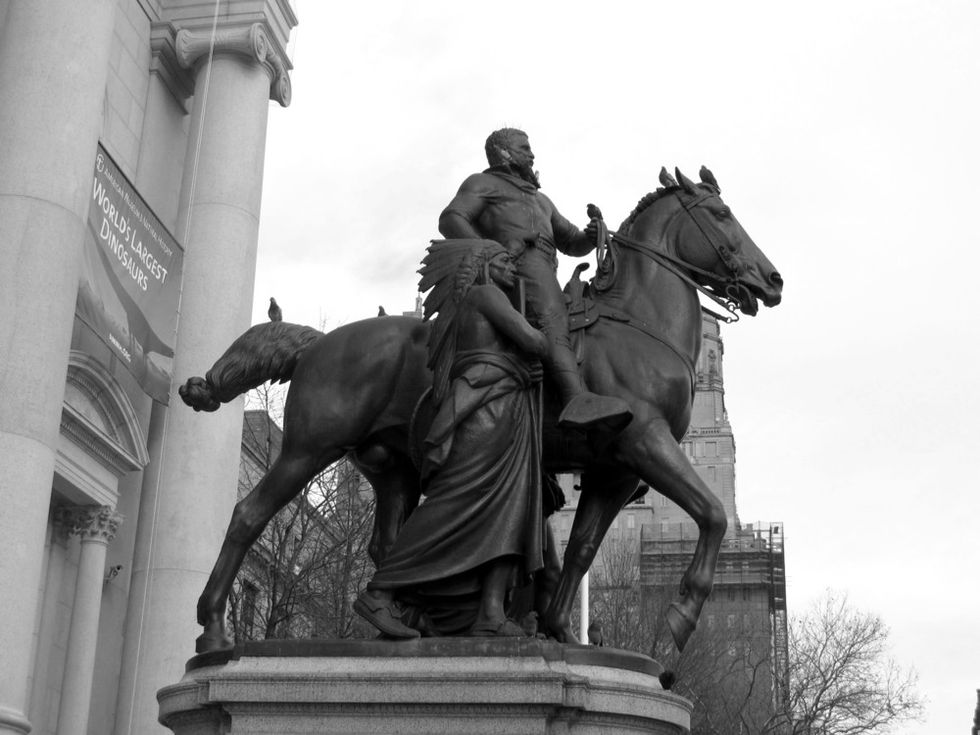 A statue of President Theodore Roosevelt riding a horse.