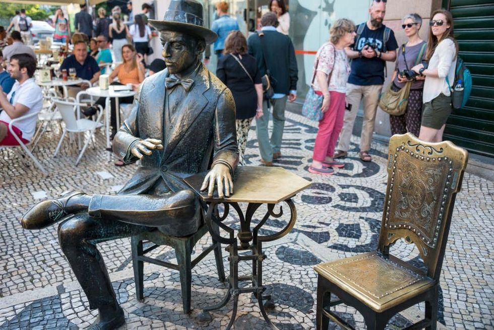 A statue of the Portugese poet Fernando Pessoa situated in Lisbon, Portugal