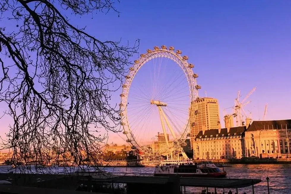 A sunset sky over the London Eye and the South Bank. 