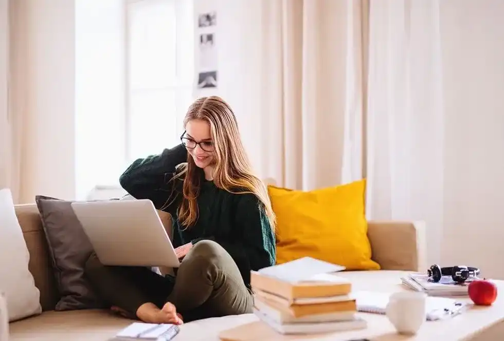 A teenage girl learning how to code.