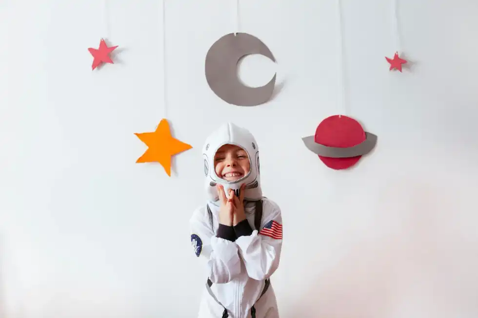 A young astronaut ready for some space crafts.