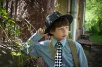 A young boy wearing classic outfit