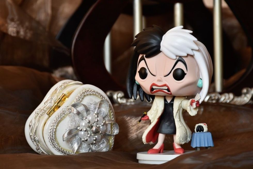 Action figure of Disney villain Cruella de Vil from animated film 101 Dalmatians.