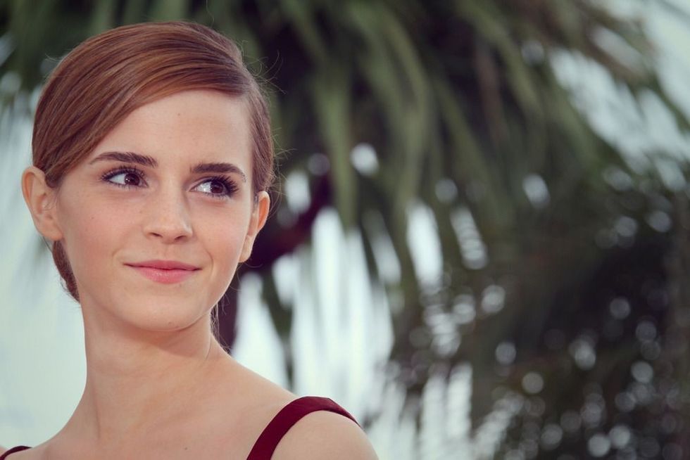 Actress Emma Watson wearing red dress.