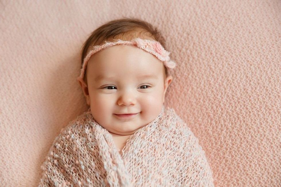 Adorable beautiful newborn baby girl. 