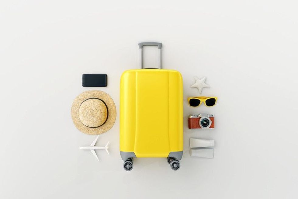 all the travel essentials in a white background