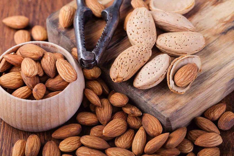 Almonds nuts on a wooden table.
