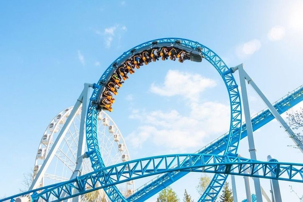 Amusement trolley makes circle loop turns upside down, roller coaster