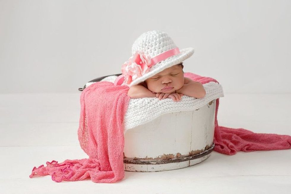 An image of a newborn baby sleeping, a perfect inspiration for sleep jokes.