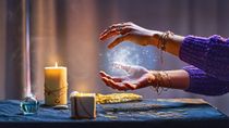 An image showing a woman's hand displaying magical luminous swirling glowing light in between her palms