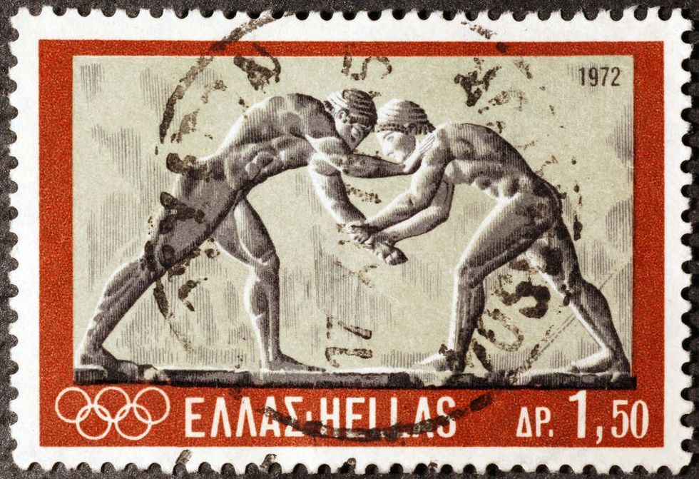 Ancient greek wrestlers on postage stamp.