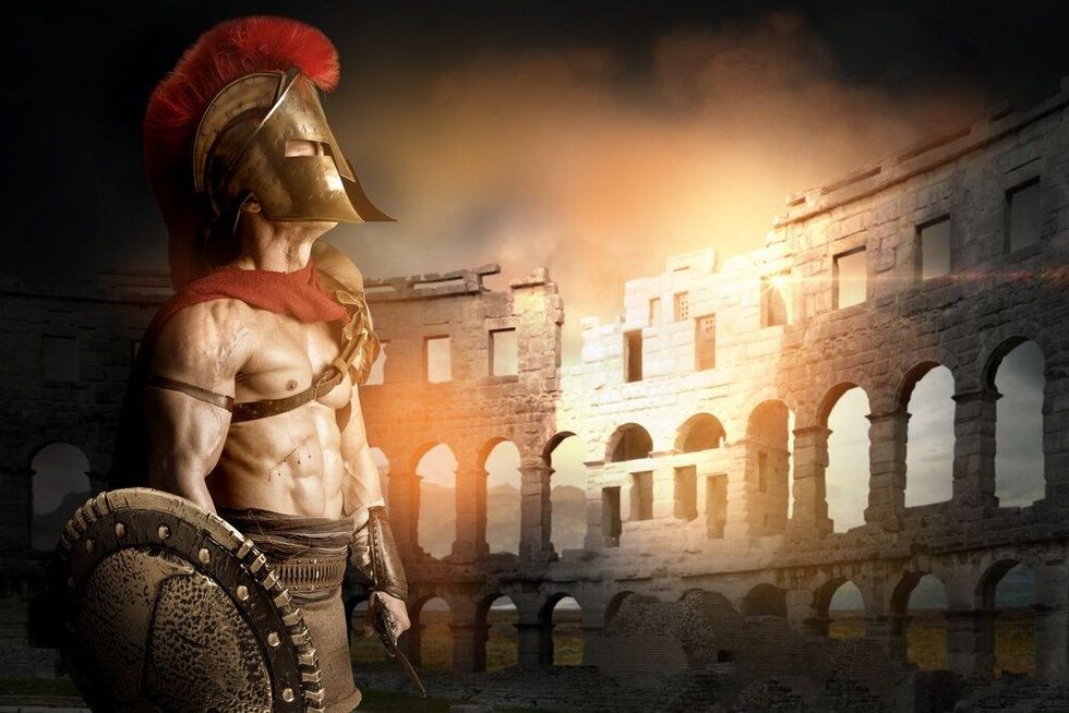 Ancient warrior or Gladiator posing in the arena