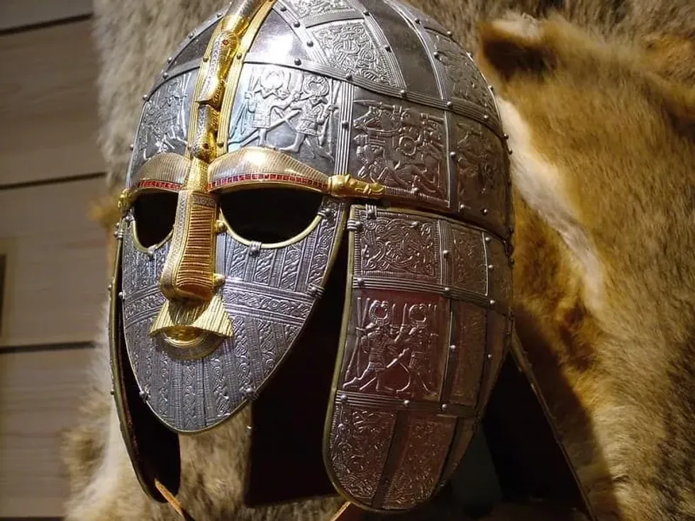 Anglo-Saxon helmet and mask armour, made of silver and gold metals.