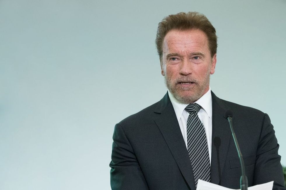 Arnold Schwarzenegger speaking on mic