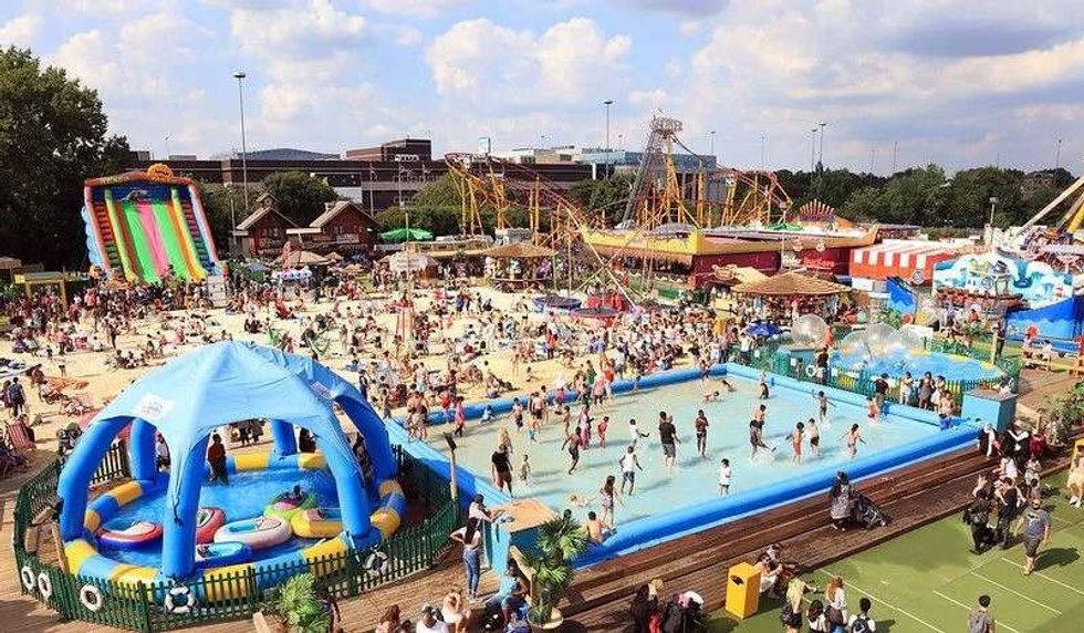 Artificial beach with crowds at Brent Cross Shopping Centre.