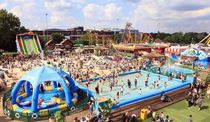 Artificial beach with crowds at Brent Cross Shopping Centre.