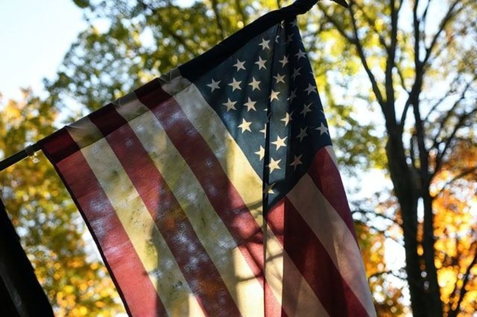 As a part of 1963 US history, the American Flag was raised on top of Mount Everest, in Nepal.