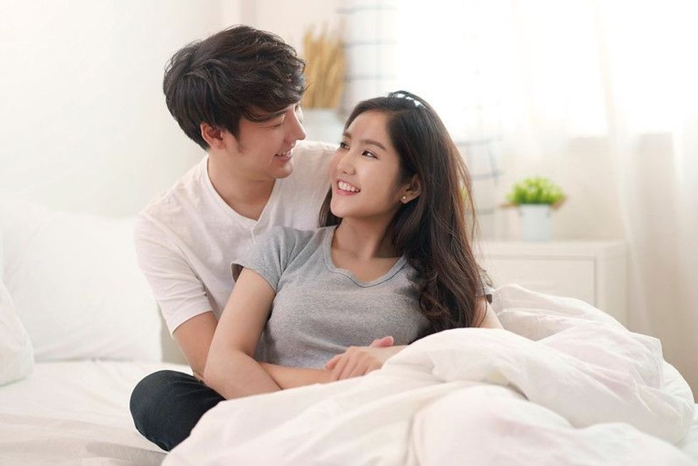 Asian young couple man and woman staying together