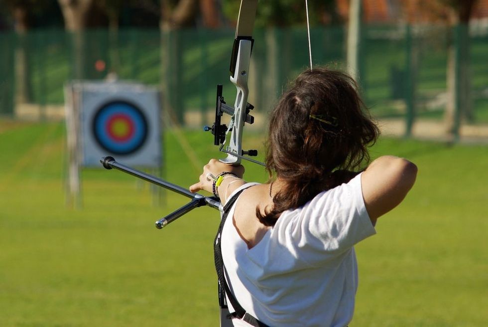Athlete aiming the target