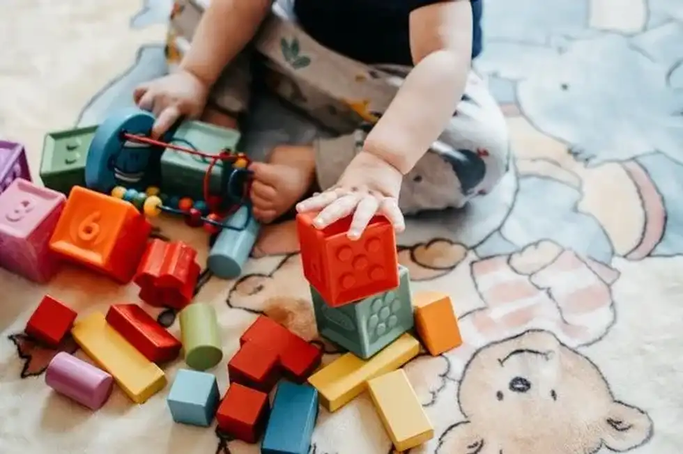 Babies learn through play. Playing games with your 6-month-old baby will help with their cognitive and physical development.