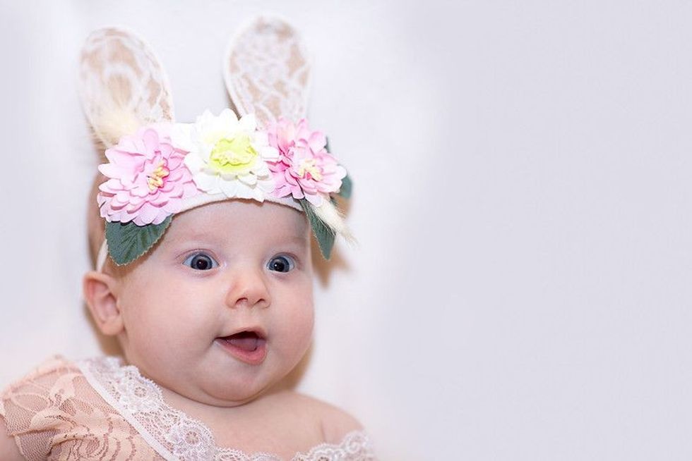Baby Easter Bunny, Dressed in a lace bodysuit and ears on her head.