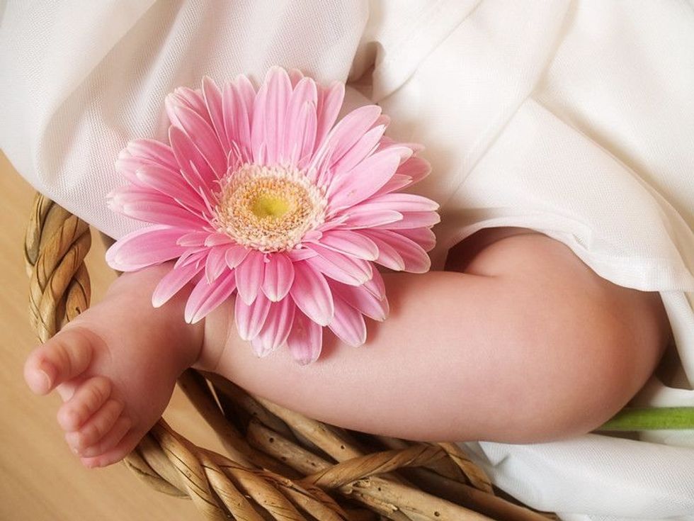 Baby foot with flower.