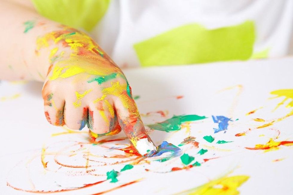 Baby painting with hands