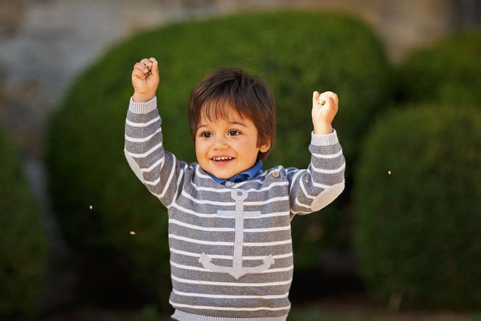 Baby playing in a park.