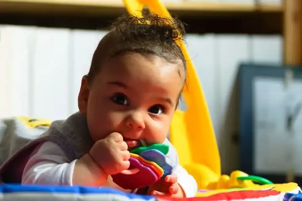 Baby playing with toys.