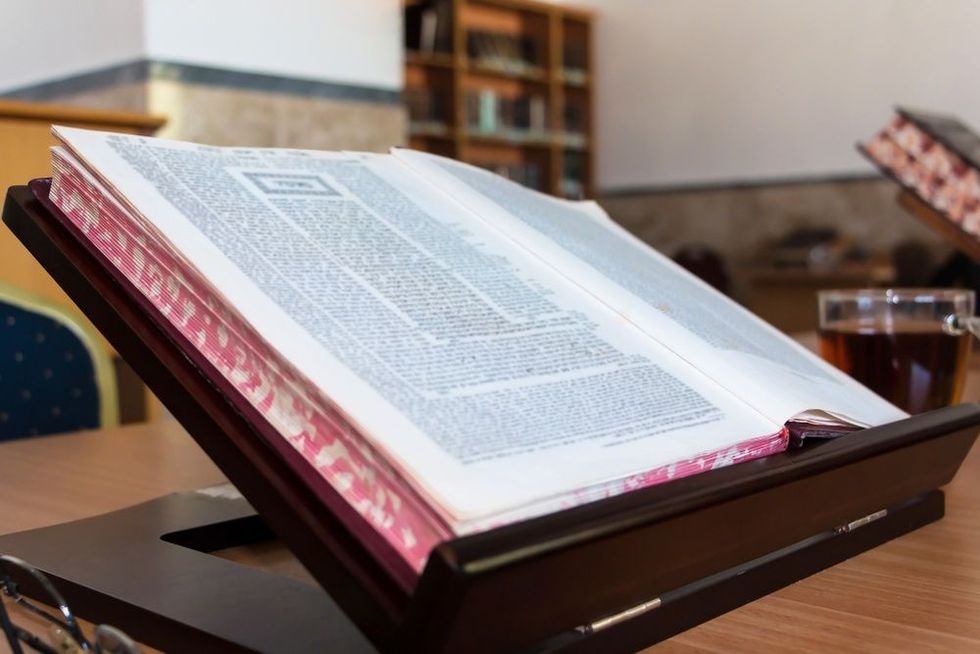 Background of Book of Talmud on Stand. 
