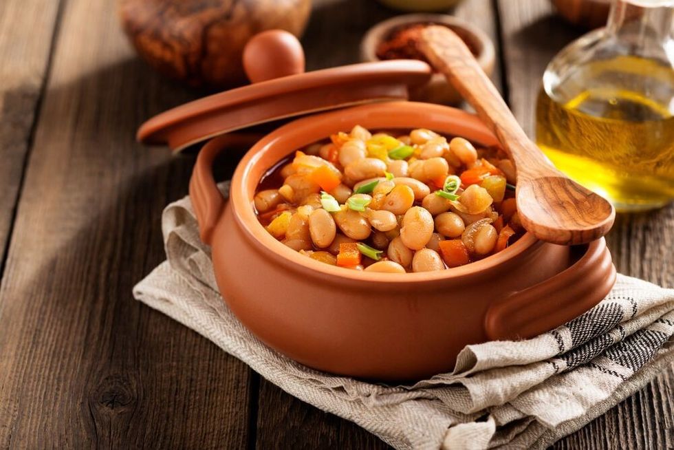 Baked beans in a tomato sauce and greens.